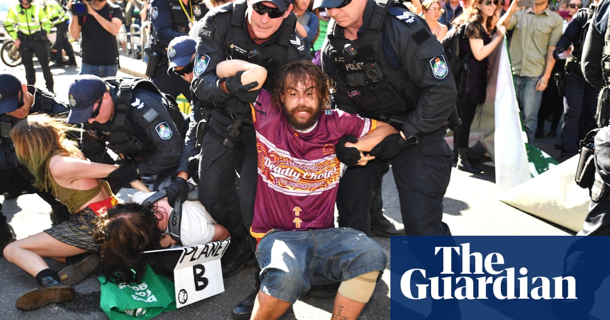 Queensland police arrest 56 climate change protesters in Brisbane