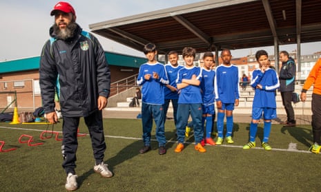 Azmani Ridoin oversees his young players at the Académie Jeunesse Molenbeek’s training ground