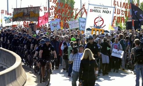Demonstrators march through Seattle, Washington, on Monday, in protest against Arctic oil drilling following a lease agreement between Shell and the city’s port. (AP Photo/Ted S. Warren)