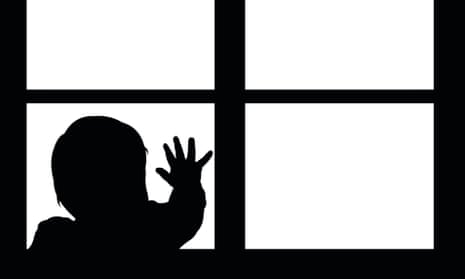 Silhouette of little baby waving hand on the window. 