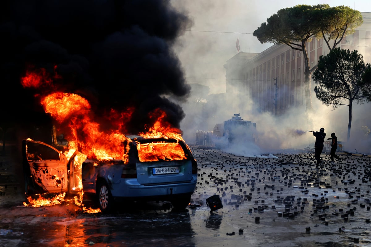 A car on fire during an anti-government demonstration outside the prime minister's office in Tirana on Saturday.
