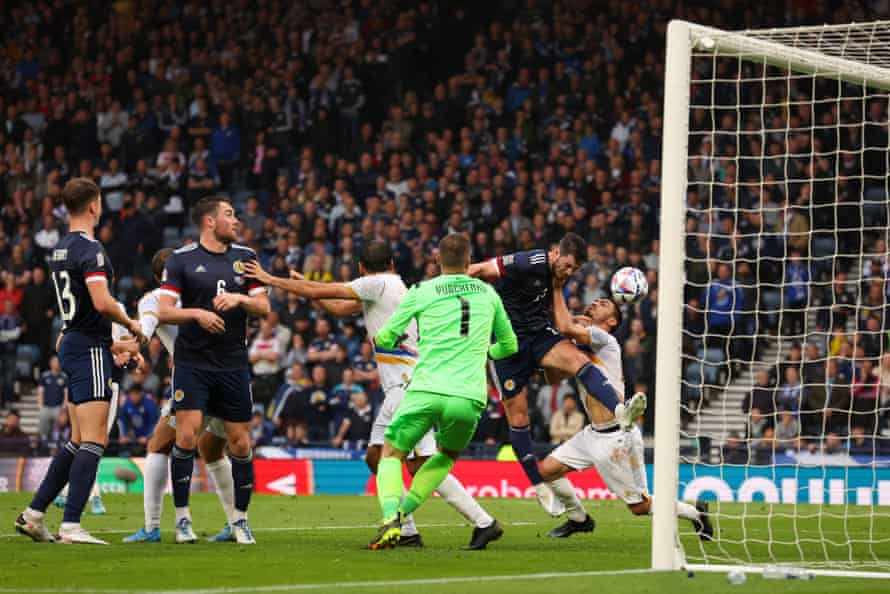 Scott McKenna nods the ball downwards to score Scotland’s second goal.
