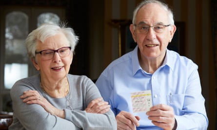 Manchester United season-ticket holder Geoffrey Fink, a regular at Old Trafford since 1945, at home in Altrincham with his wife, Ruth.