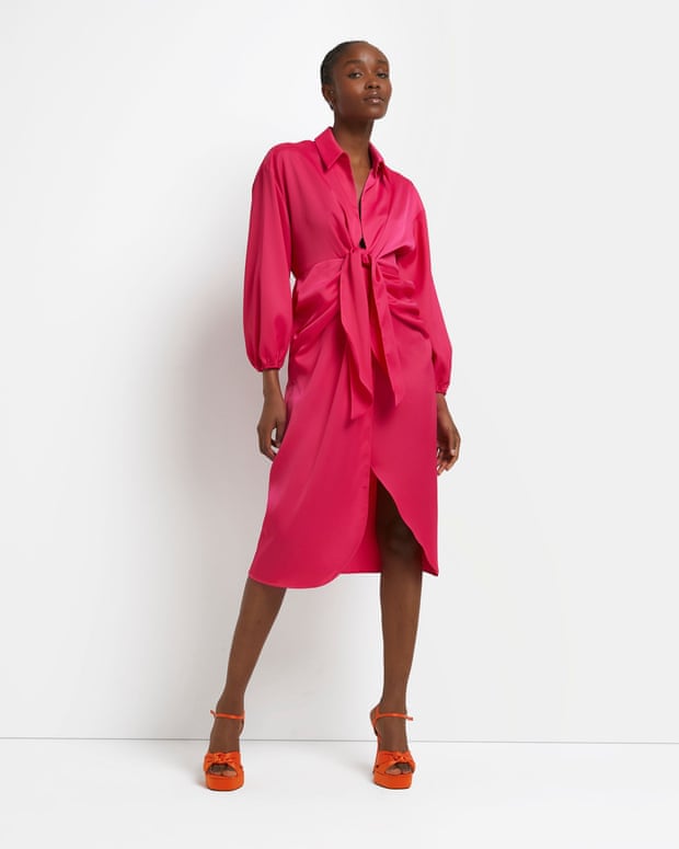 Model wearing spring 2022’s most stylish colour, River Island hot pink front tie dress