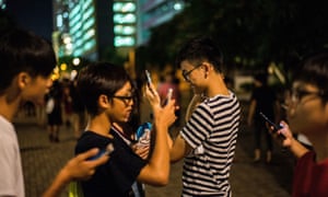 ‘Outdoor exodus’: gamers play Pokémon Go at a park in Hong Kong.