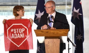An anti-Adani coalmine protester interrupts a Scott Morrison speech