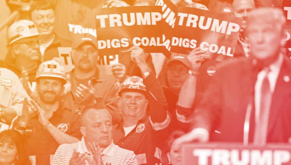 Coal miners wave signs as Republican presidential candidate Donald Trump speaks during a rally in Charleston, W.Va.