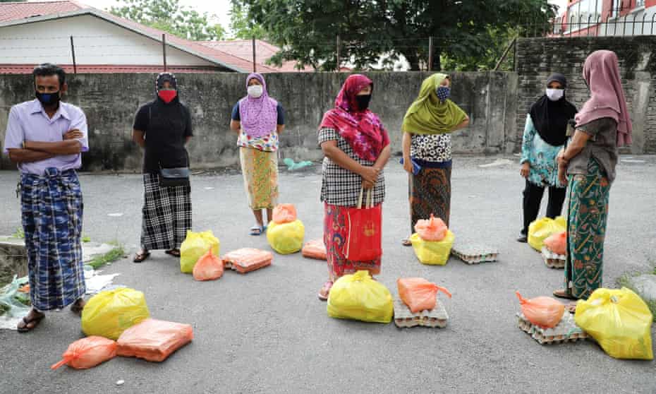 Malaysia Cites Covid 19 For Rounding Up Hundreds Of Migrants Malaysia The Guardian