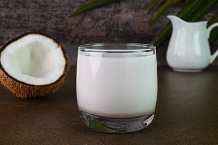 Coconut milk in a glass cup.