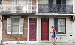 A man walks past some residential houses in Sydney