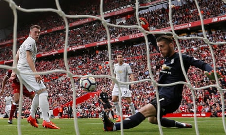 David De Gea makes a save with his left foot from Matip’s shot.