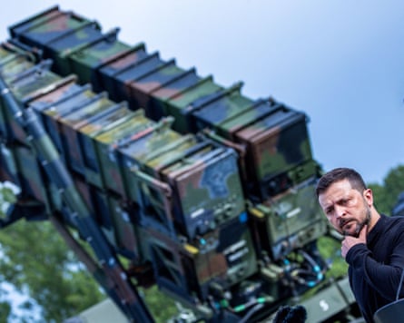 Ukraine’s Volodymyr Zelenskyy in front of a Patriot air defence missile system.