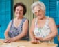 Two elderly women making pasta