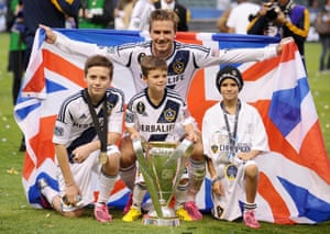 David Beckham poses his sons after winning MLS Cup in 2012