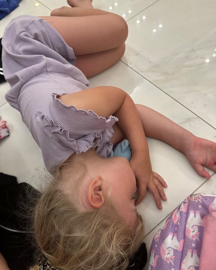 Andy Bell’s daughter sleeps on the resort floor.