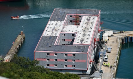 aerial view of Bibby Stockholm accommodation barge moored in the harbour at Portland, Dorset