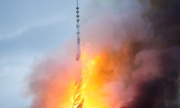 A view of the old stock exchange's ‘twisted dragons on spire’ during a fire in Copenhagen. The spire collapsed in the fire.