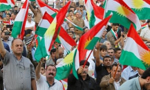 People wave flags to show their support for the forthcoming independence referendum in Kirkuk, Iraq.