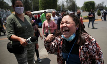 A resident reacts as she arrives at the crash site at Los Olivos station in Mexico City on Tuesday.