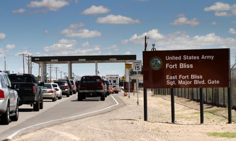 Cars wait to enter Fort Bliss in El Paso, Texas. 
