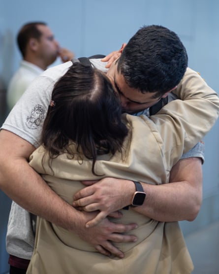 Peter hugs his birth mother, Mariza, when they meet for the first time, at Santiago airport, Chile