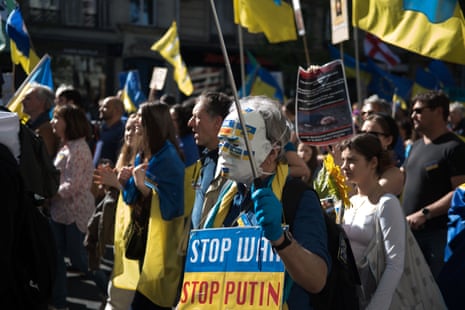 Demonstrators and Ukrainian flags, during the march against Russia’s invasion of Ukraine, in Paris, 16 April.