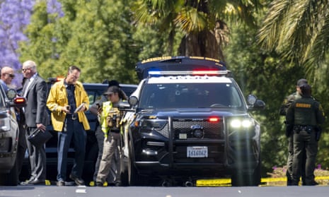 Investigators gather outside the Geneva presbyterian church in Laguna Woods, California, on Sunday after the fatal shooting