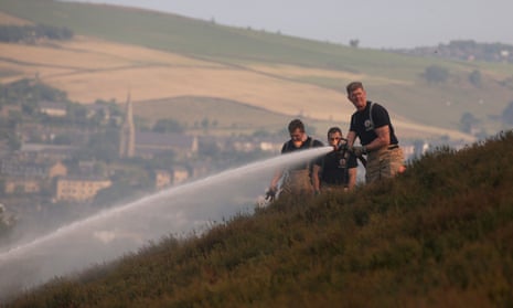 Firefighters on Saddleworth Moor in north-west England attempt to stop the spread of fire during Britain’s heatwave in June 2018