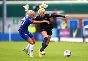 Chloe Kelly of Manchester City shrugs off the challenge of Chelsea’s Pernille Harder