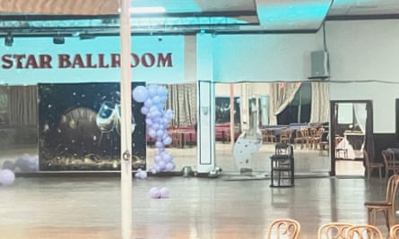 A view of the inside of the Star Ballroom dance studio as seen through a window.