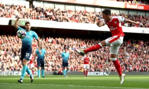 Mesut Özil volleys in the goal that eventually clinched Arsenal’s victory.