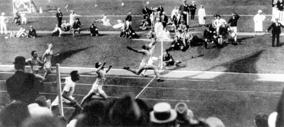 USA’s Charley Paddock leaps across the line to win gold from teammate Morris Kirksey (silver) and Great Britain’s Harry Edward (closest to camera) judged to have pipped Jackson Scholz for the bronze in the final of 1920 Olympic 100m in Antwerp