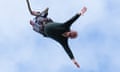 Ed Davey taking part in a bungee jump during a visit to Eastbourne Borough Football Club.