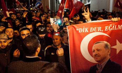 Turkish people gather to protest outside the Turkish consulate general’s residence in Rotterdam