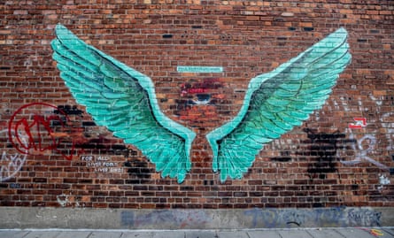 A pair of large liver bird wings painted on the side of a building in the Baltic Triangle area of Liverpool.
