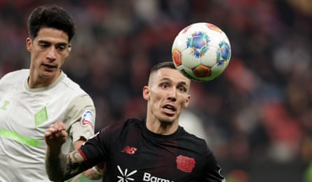 Julian Malatini of Werder Bremen (left) marks Alejandro Grimaldo of Leverkusen.