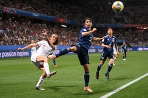 Jill Scott from England kicks the ball into the box.