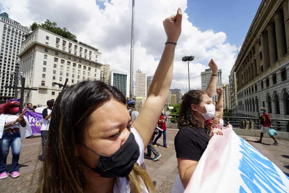 Women take part in a protest against Jair Bolsonaro, demanding coronavirus vaccines and emergency aid, on International Women’s Day in Sao Paulo, Brazil on 8 March.