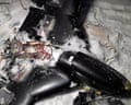 Russian picture claimed to show a crashed Ukrainian drone. The black object lies in snow with its casing open and wires and mechanisms visible