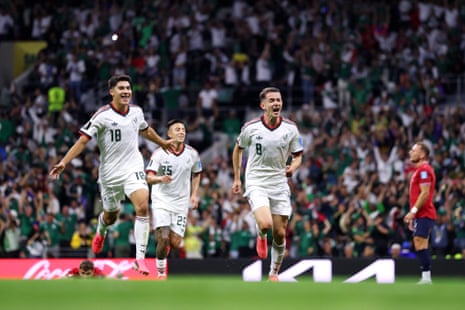 Alvaro Fidalgo #8 of Mexico celebrates with teammate Obed Vargas