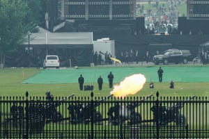 Members of the military fire cannons as part of a 21-gun salute.