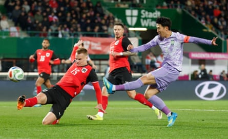 Son Heung-Min shoots at goal against Austria