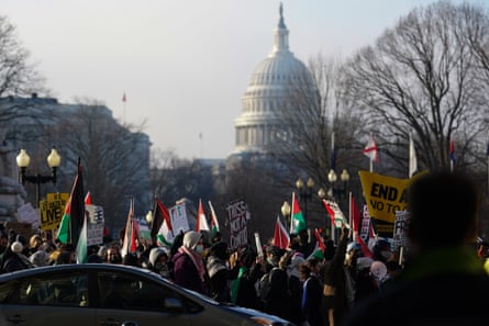 people march with palestinian flags