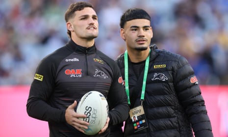 Panthers playmaker Nathan Cleary and the unfortunate Taylan May soak up the grand final atmosphere.