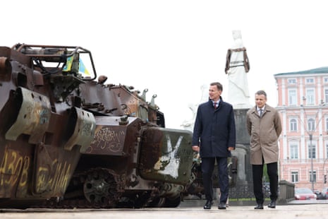 The UK chancellorJeremy Hunt (left) walks with Ukrainian minister Sergii Marchenko past parked tanks during his visit to Kyiv on Thursday.