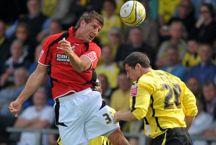 BournemouthâÂÂs Steve Fletcher and BurtonâÂÂs Shaun Kelly battle for the ball in a League Two match in 2010