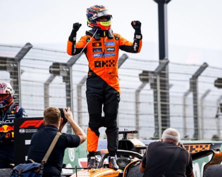 Oscar Piastri stands triumphant atop his McLaren after cruising to victory in the Dutch Grand Prix
