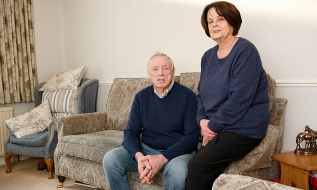 Frank and Joan Johnston sitting on their faulty Sofa