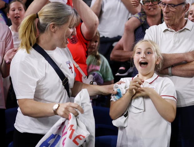 A young fan reacts after receiving the shirt of Ellen White of England.