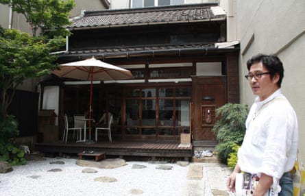 Mitsuhiro Tokuda in the backyard of a traditional home in Kitakyushu – now converted into a cafe.